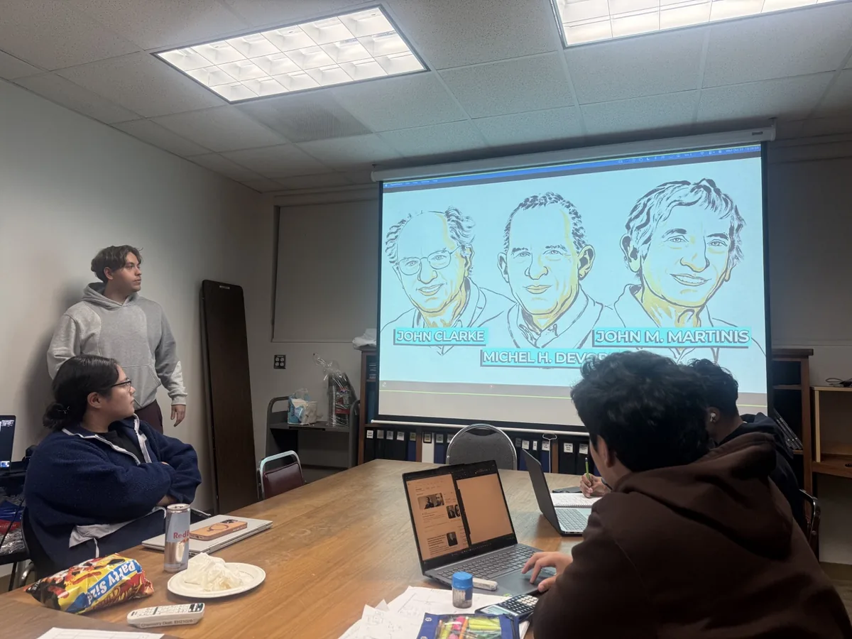 Austin presenting a Chemistry Club talk about the 2025 Nobel Prize in Physics