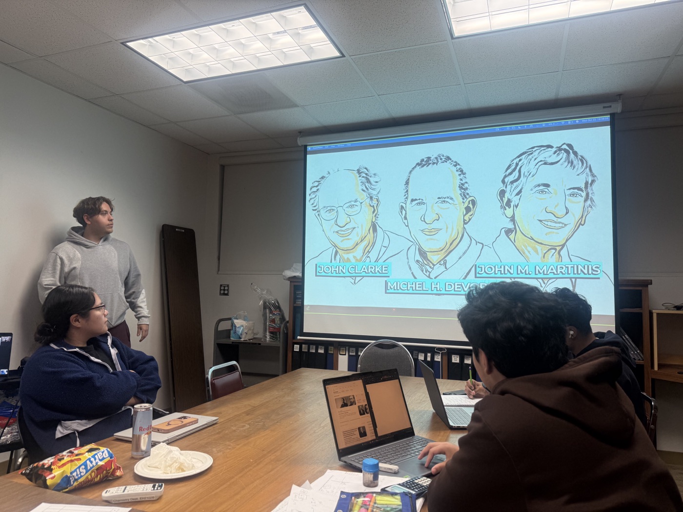 Austin presenting a Chemistry Club talk about the 2025 Nobel Prize in Physics